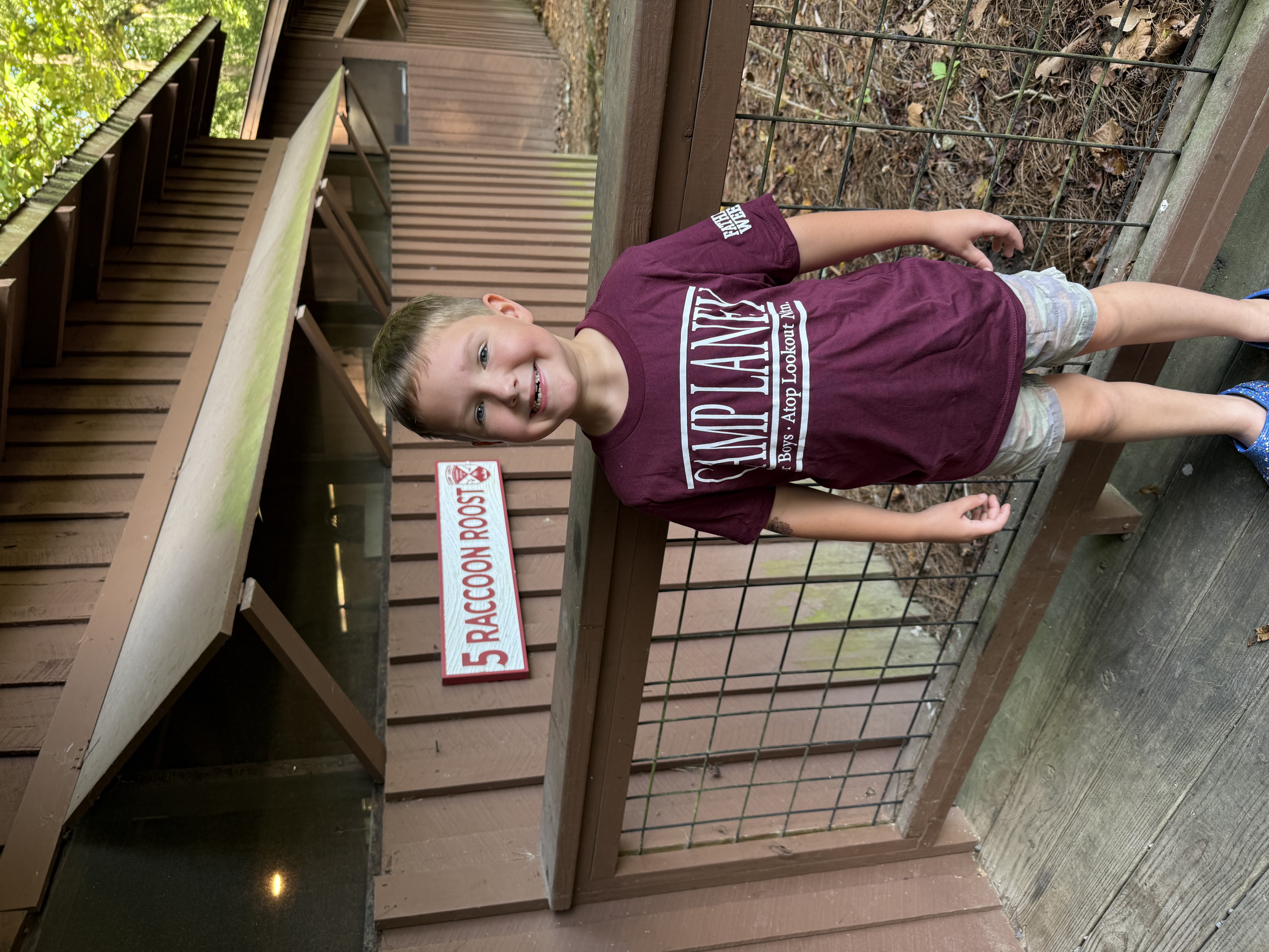 Wil standing in front of Racoon Roost, our cabin at Camp Laney